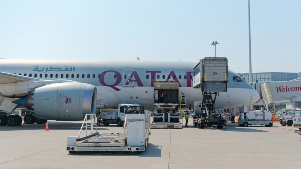 Airplane being serviced at an airport gate
