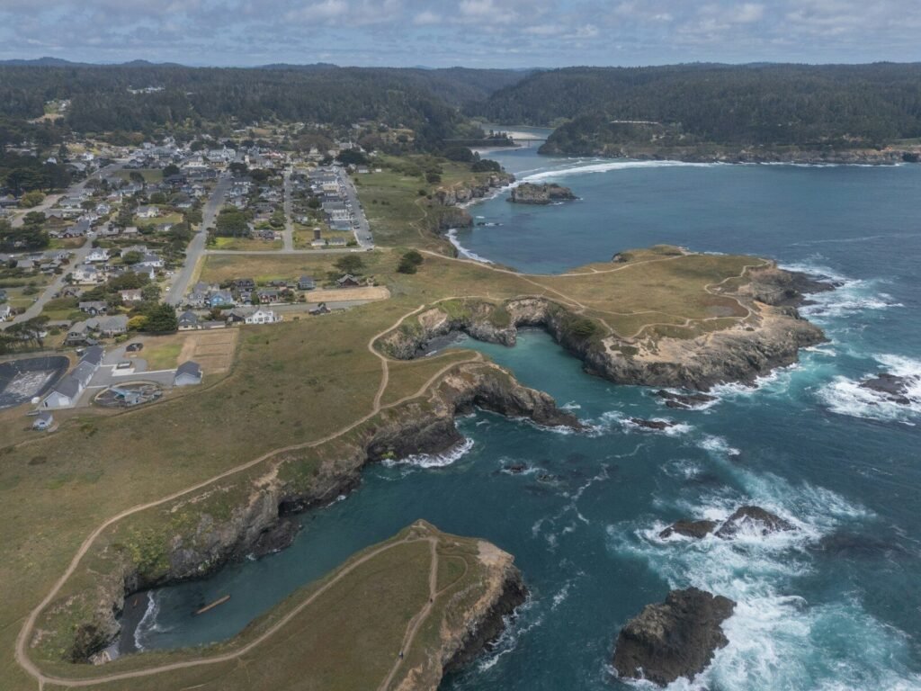 Coastal town and rugged cliffs overlooking the ocean